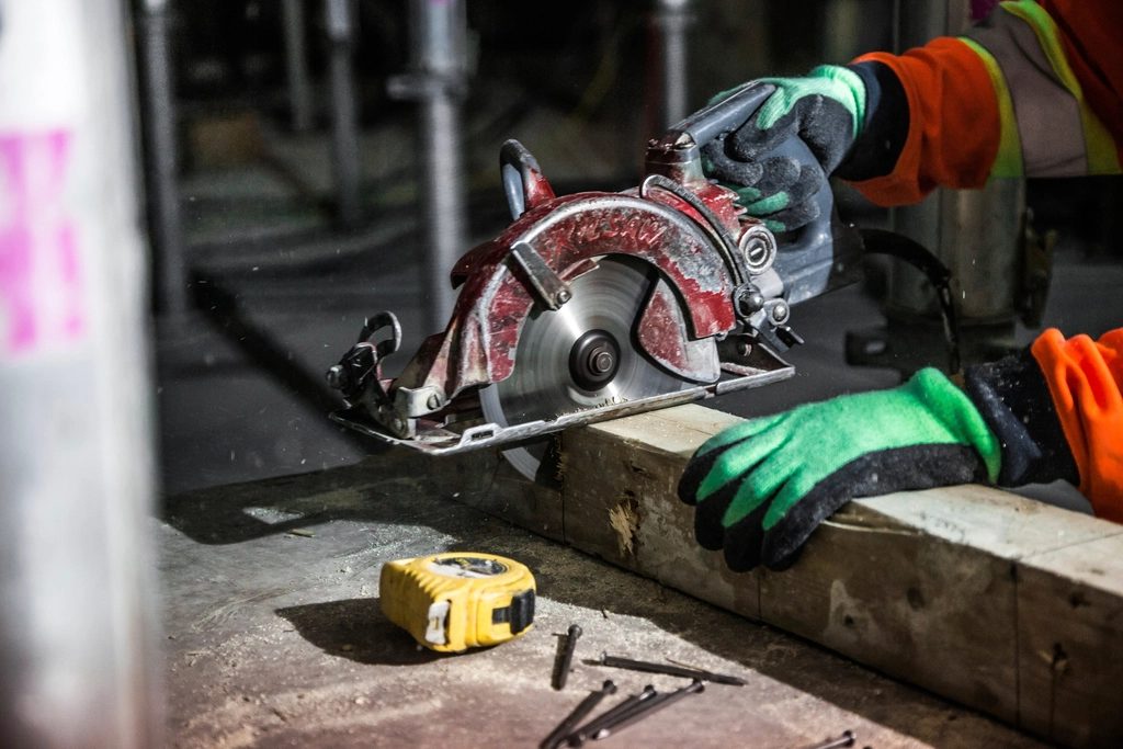 Contractor cutting lumber on a job site